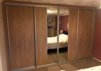 Oak built in wardrobe with double mirror | The Sliding Wardrobe Company | Kent | Essex | East Sussex